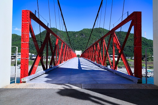 Red Mino Bridge over the Nagara River in Mino City, Gifu Prefecture