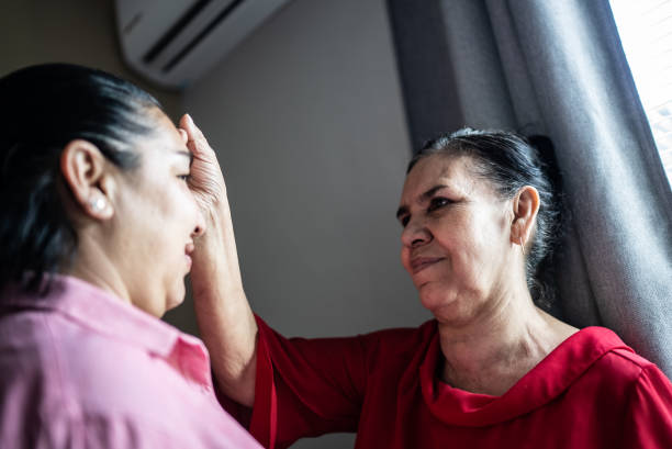 istock Mother blessing her daughter at home 1412893377