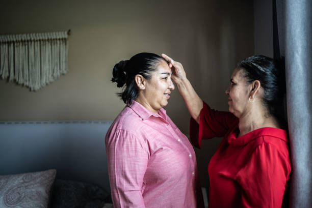 istock Mother blessing her daughter at home 1412893381
