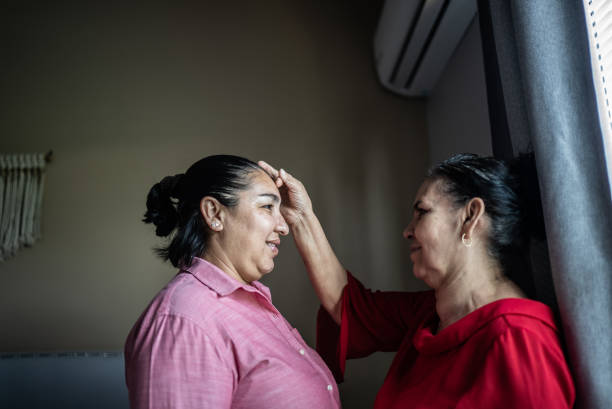 istock Mother blessing her daughter at home 1412893390