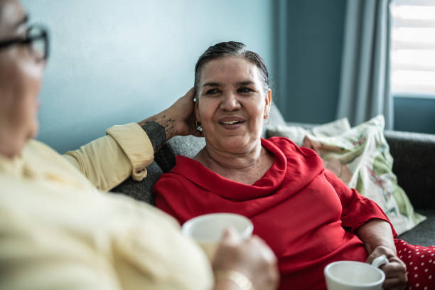 istock Mother and daughter talking at home 1412893575