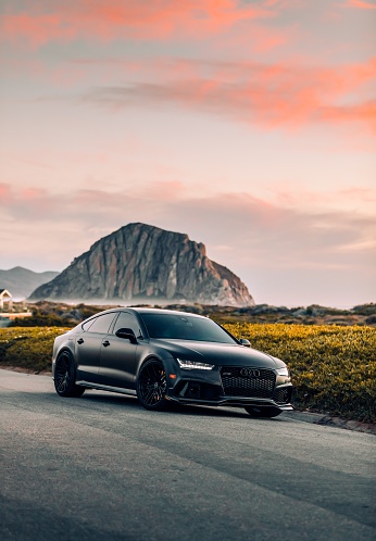 LA, CA, USA\nJuly 28, 2022\nMatte Black Audi RS7 parked with a mountain in the background