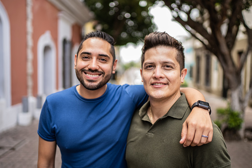 Portrait of young gay couple at the historic district