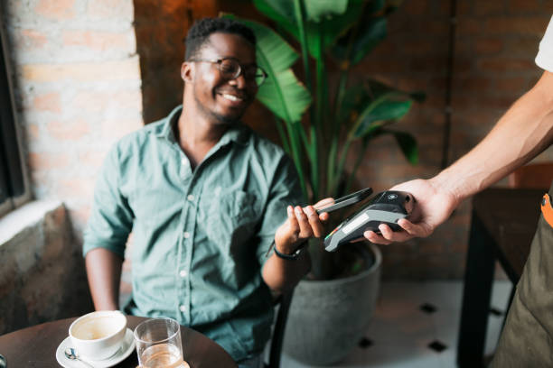 istock Paying electronically in a coffee shop 1412895829