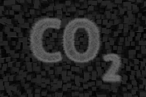 CO2 emissions illustration. A translucent cloud in the form of the chemical formula of carbon dioxide against a jet-black background formed by black squares. 3D rendering