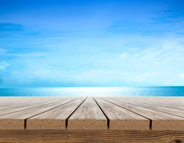 istock indigo wood table top and blue background Products can be placed or cut for display - concept, beach and summer 1412897543