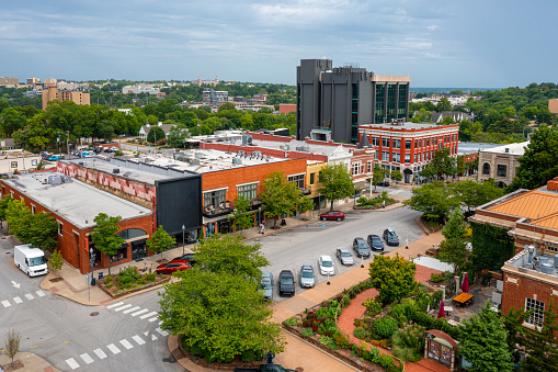 Hudson, OH, USA - June 14, 2014: Quaint shops and businesses, anchored by the popular Learned Owl bookstore at right, go back more than a century give Hudson's Main Street a charming and inviting appeal.