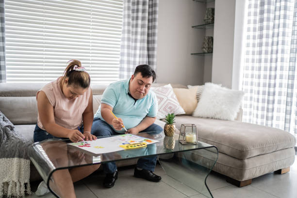 istock Couple with special needs painting at home 1412899553