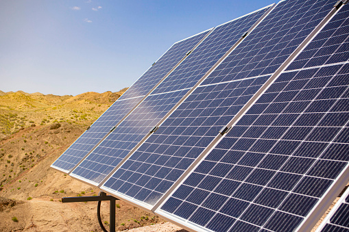 Autonomous solar energy station close-up in the desert mountains against the blue sky