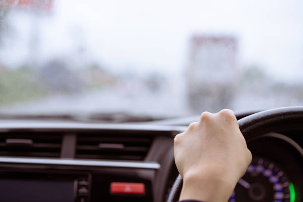 istock Woman driving in the rain. 1412900762