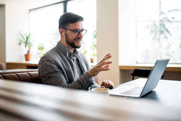 istock Businessman working in the morning during coffee break on video call 1412900903