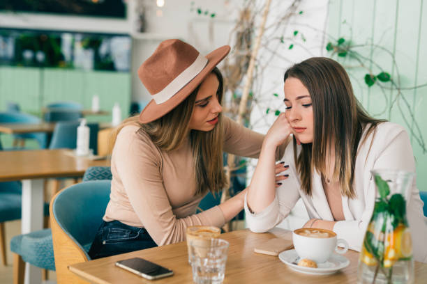two woman friends in cafeteria