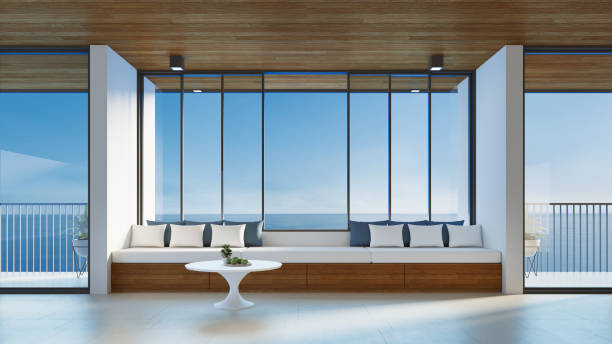 istock modern living room interior and sea view - 3D rendering 1412902518
