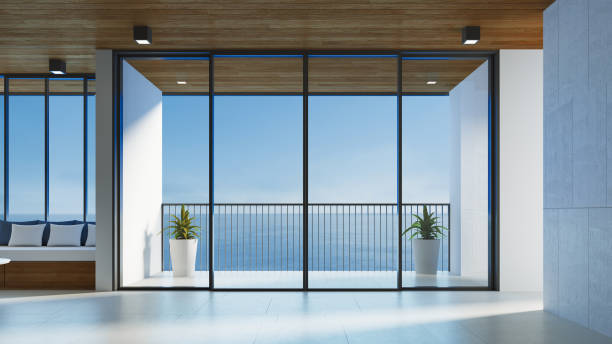 istock modern living room interior and sea view - 3D rendering 1412902525