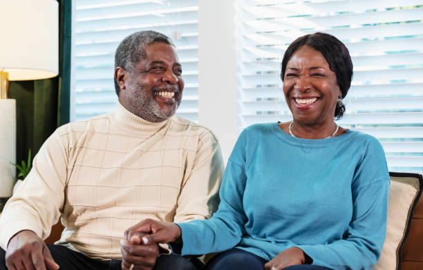 istock Senior African-American couple sitting on couch 1412903779