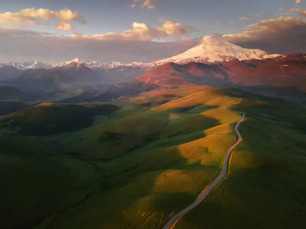 Elbrus mount at sunrise. Road to Gil-Su valley in North Caucasus, Russia. Beautiful summer landscape