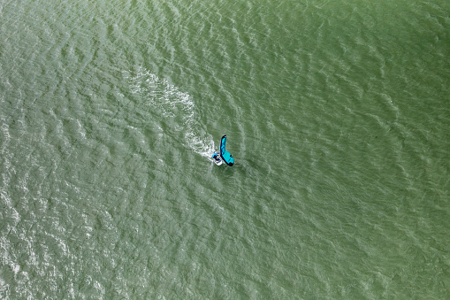 Aerial photo from a drone of an inflatable windsurfer in Maylandsea, Essex, UK.