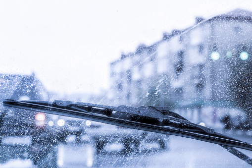 Car tank close-up. Car under snow. Winter weather. Climate. Storm. Transportation