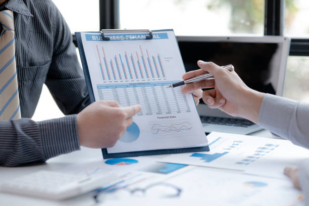 istock Two businessmen pointed to the material for the meeting, working together to plan to develop and solve common business problems. Concept of business management for growth and quality. 1412907757