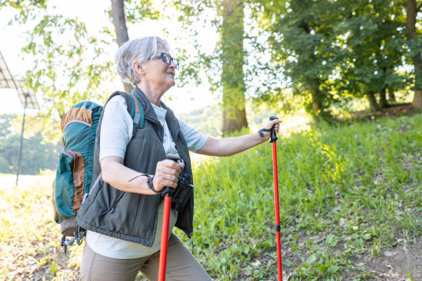 istock Senior woman wearing eyeglasses when hiking 1412909557