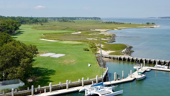 Scenic view of a golf course and coastline in Harbour Town on Hilton Head Island.  This photo was taken from the top of a lighthouse on a warm summer sunny morning.