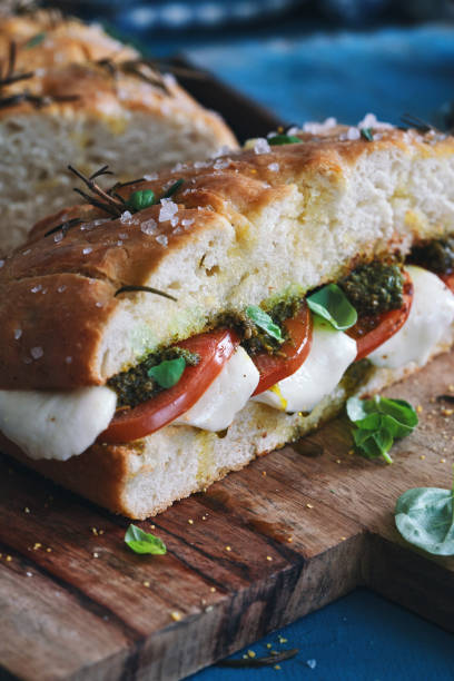 istock Focaccia Sandwich with Tomatoes,  Mozzarella, Pesto and Basil 1412914719