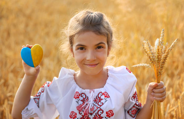 istock Portrait Of Young Woman Holding Easter Egg 1412916362