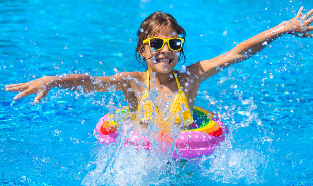istock Cute Girl Swimming At Pool 1412916503