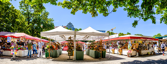 Munich, Germany - August 3: typical regional market (called Auer Dult) with stalls for household goods, crockery, textiles and clothing every three months on mariahilfplatz in munich on August 3, 2022