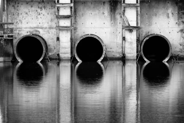 Black and White Reflection Pictures of Drainage pipes on an Old Pump House in Central Florida
