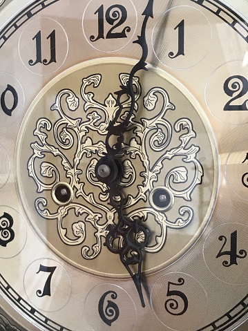 Detail of a broken antique clock.