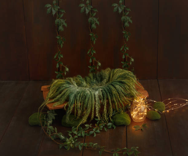 istock Shoot set up with prop bed and wood backdrop. 1412924637