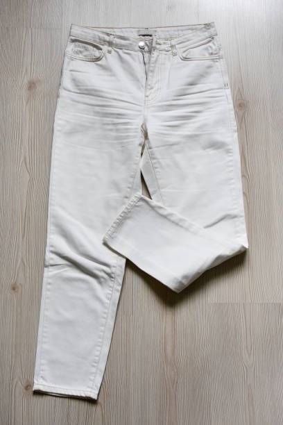 istock White denim pants on the wood background 1412928230