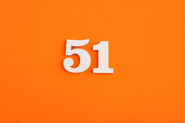 istock White wooden number 51 on eva rubber orange background 1412928398