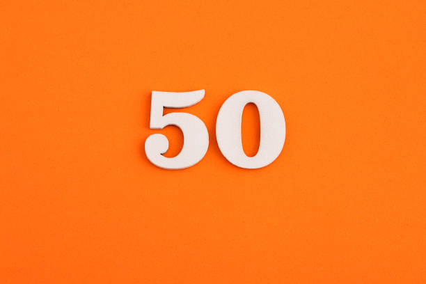 istock Number 50 - On orange foam rubber background 1412928459
