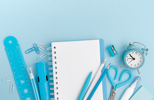 Stationery, school supplies on pastel blue background. Top view, mockup