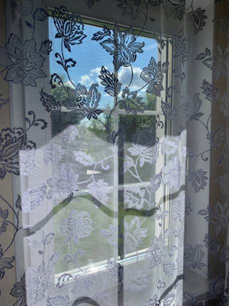 istock Window with curtains in the village 1412931614