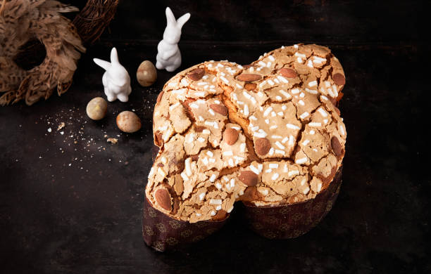 Colomba Pasquale, Italian Easter Dove Sweet Bread Colomba di Pasqua on dark surface. Selective focus. space for text. Colomba Pasquale, Italian Easter Dove Sweet Bread Colomba di Pasqua on dark surface. Selective focus, space for text. Traditional dessert in Italy. knif stock pictures, royalty-free photos & images