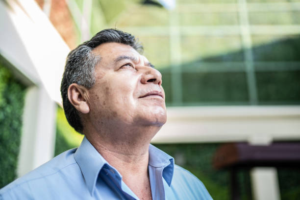 istock Mature man contemplating outdoors 1412934282