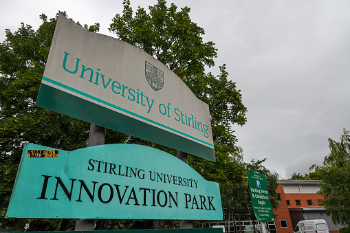 Sterling, Scotland- July 13, 2022: Sign of University of Sterling at entrance. The University of Sterling is a public university in Stirling, Scotland, founded by royal charter in 1967.