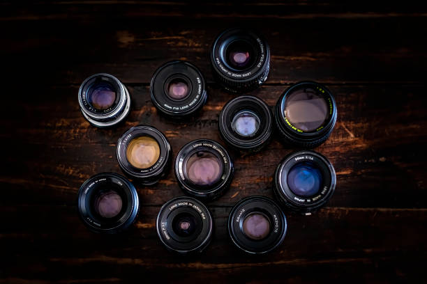 A collection of vintage photographic lenses, representing an analogue era that inspires creativity with today's modern technology.