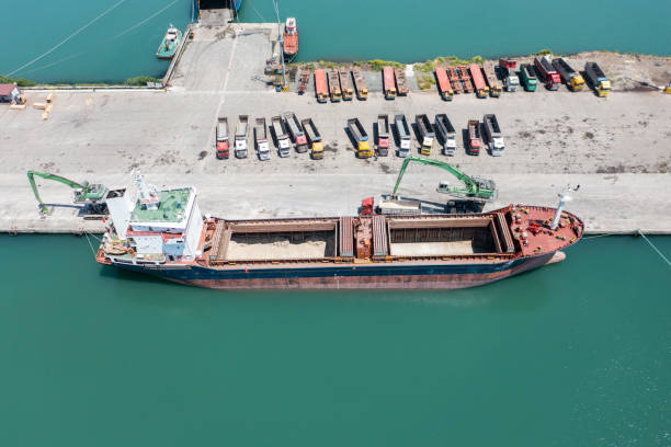istock Loading trucks in commercial port. Truck transportation. 1412940634