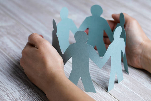 istock Hand Protecting Paper Cut Out Figure 1412941935
