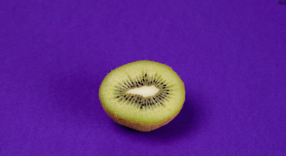 Kiwi slices on the purple background.