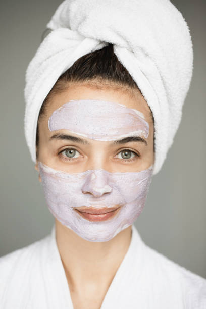 istock Young Woman with Blueberry Mask 1412943323
