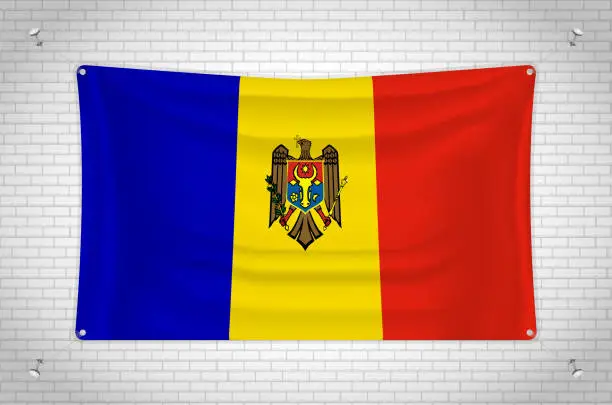 Vector illustration of Moldova flag hanging on brick wall.