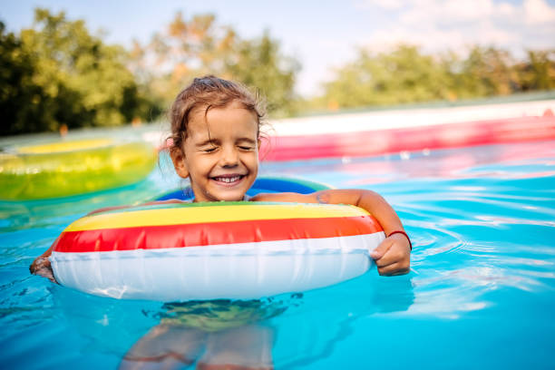 istock Cheerful girl in swimming pool 1412948864
