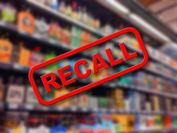 Blurry interior of a grocery store aisle behind large red Recall text Blurry interior of a grocery store aisle behind large red Recall text food recall stock pictures, royalty-free photos & images