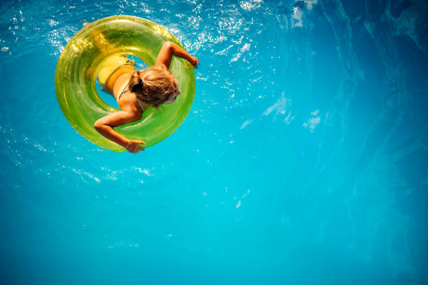 istock Girl swimming in the pool 1412950128