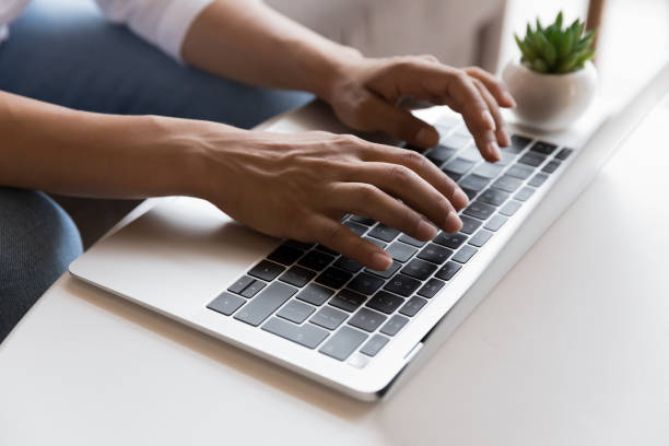 istock Young freelancer woman working at computer at home, using laptop 1412950902